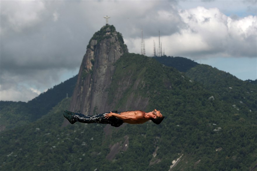 Week in pictures: An acrobat gives a gravity defying performance at Rio de Janeiro's tourist hill station, Urca.