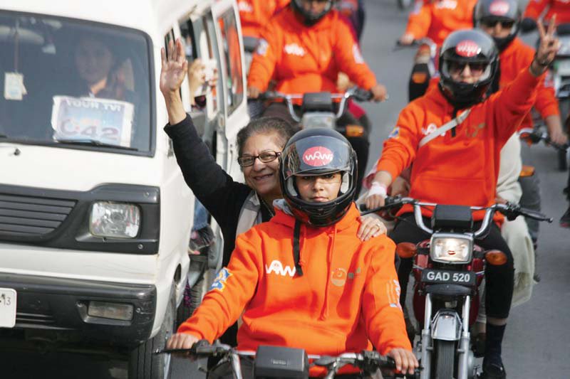 A gleeful Asma Jahangir participates in the Women on Wheels rally in Lahore in 2016. 150 women