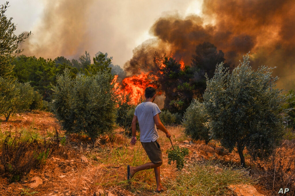 man can be seen near fires