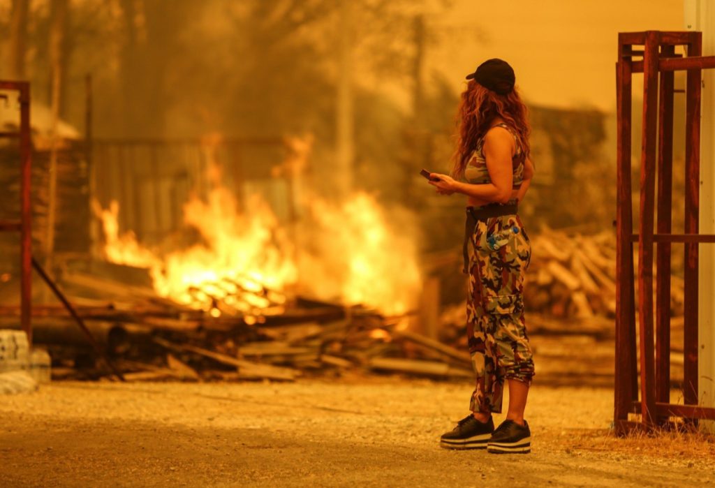 resident watches flames of fire