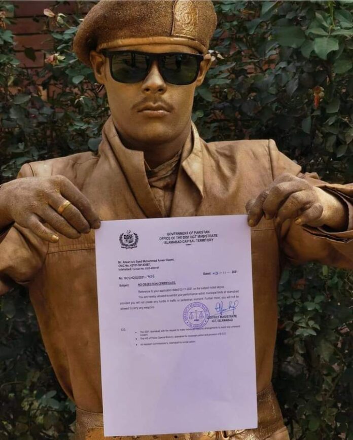 golden statue boy islamabad